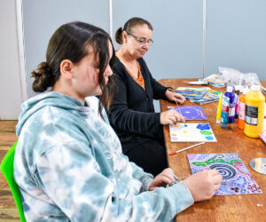 Fairbridge Education - A mentor guiding their student in arts and crafts